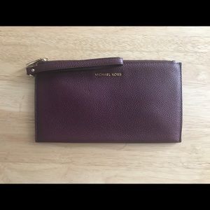 Like new Michael Kors burgundy wristlet